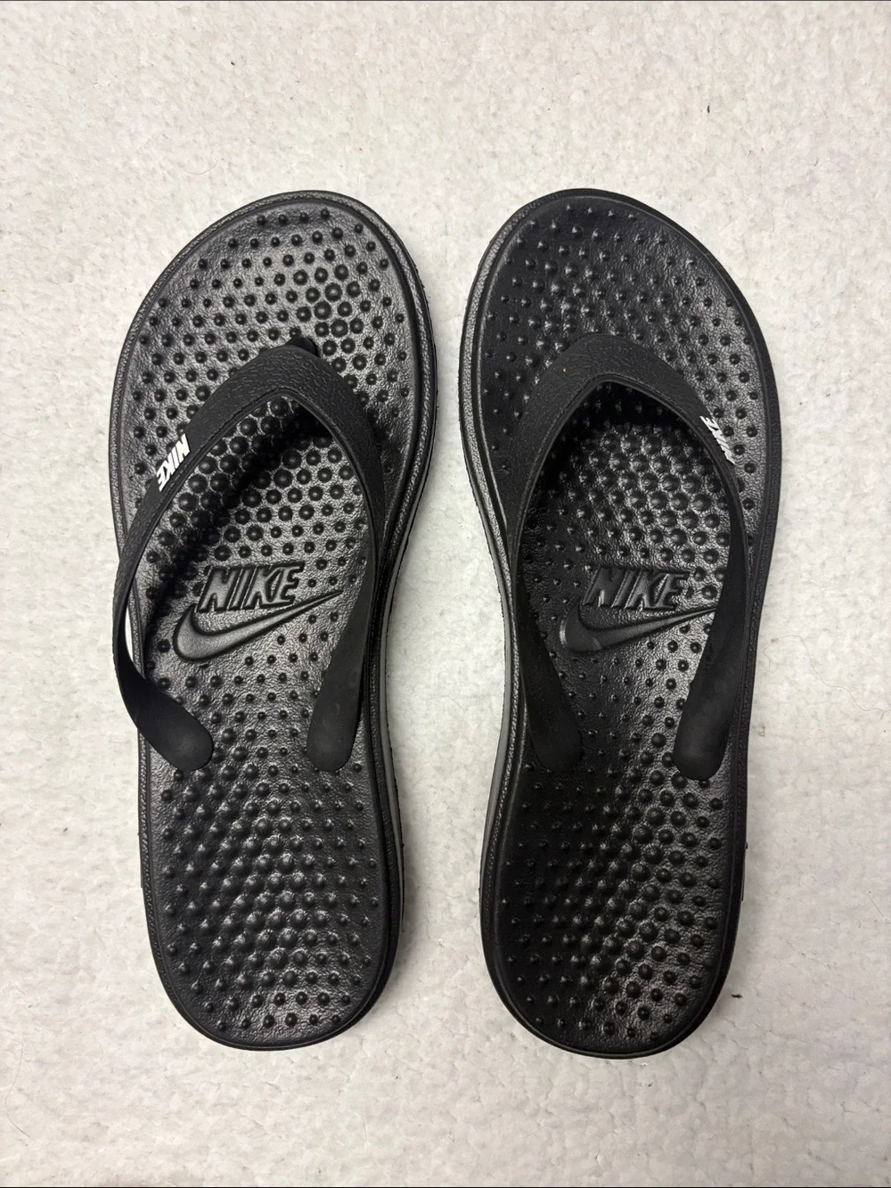 Nike size 3 All-Black Textured Thong Sandals